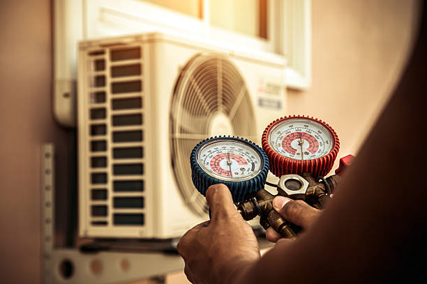 Professional Air Conditioning Service technician working in Burtonsville, MD